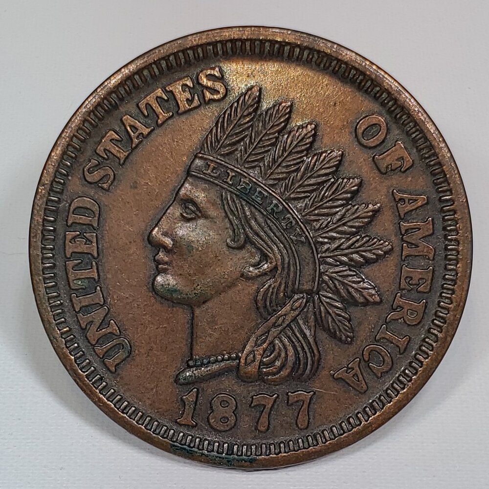 NOVELTY OVERSIZE REPLICA OF AN 1877 INDIAN HEAD PENNY